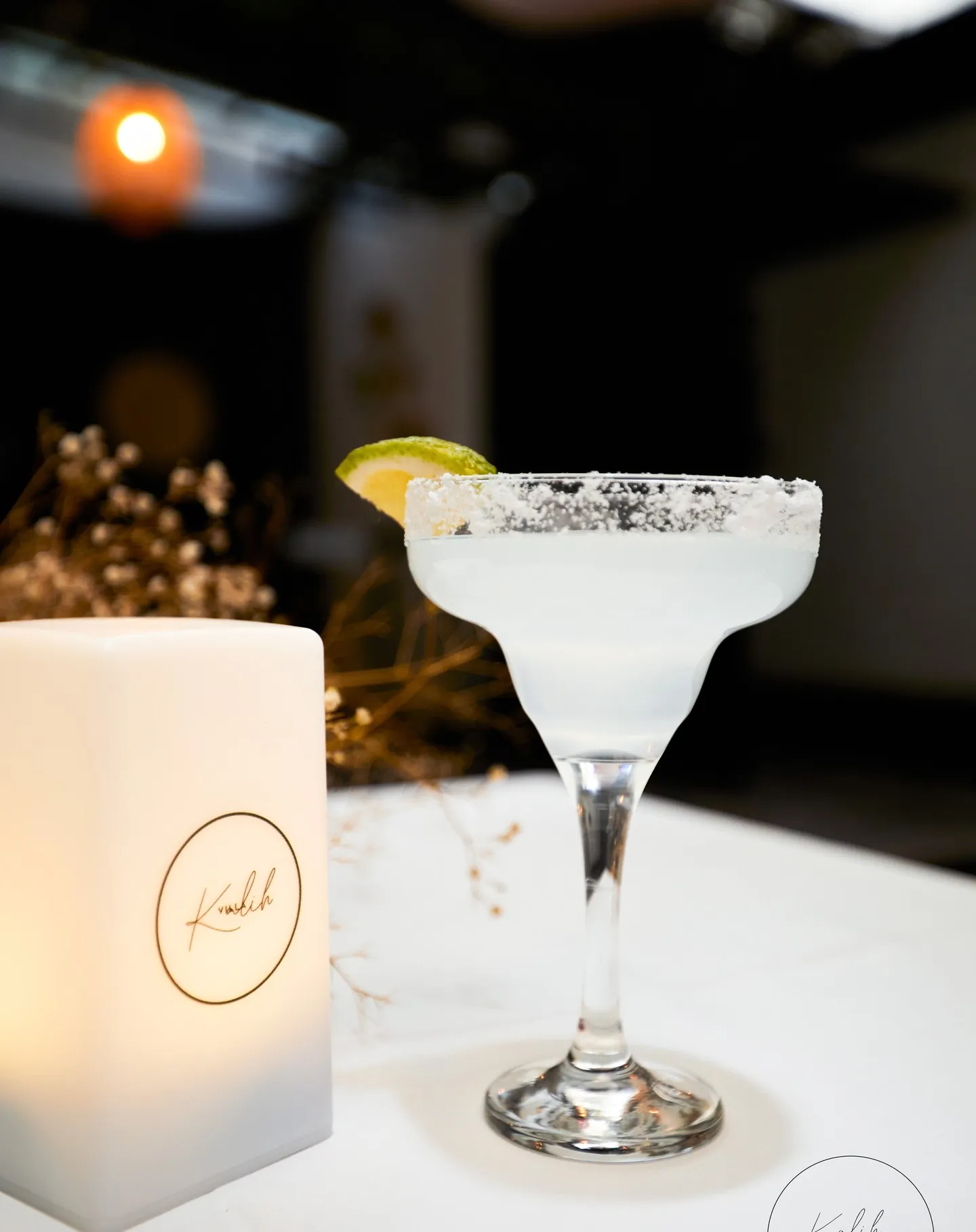 A margarita on the bar at Kalih Villa after dark